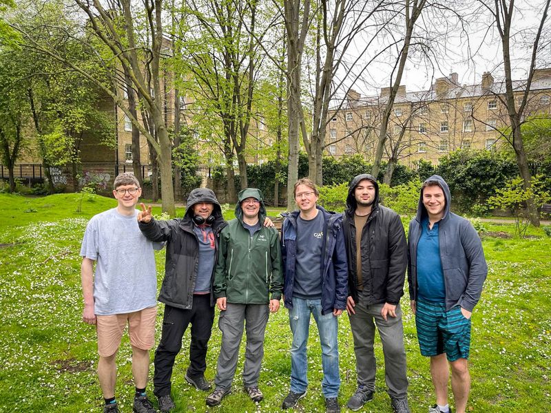Staff members working in a community garden.